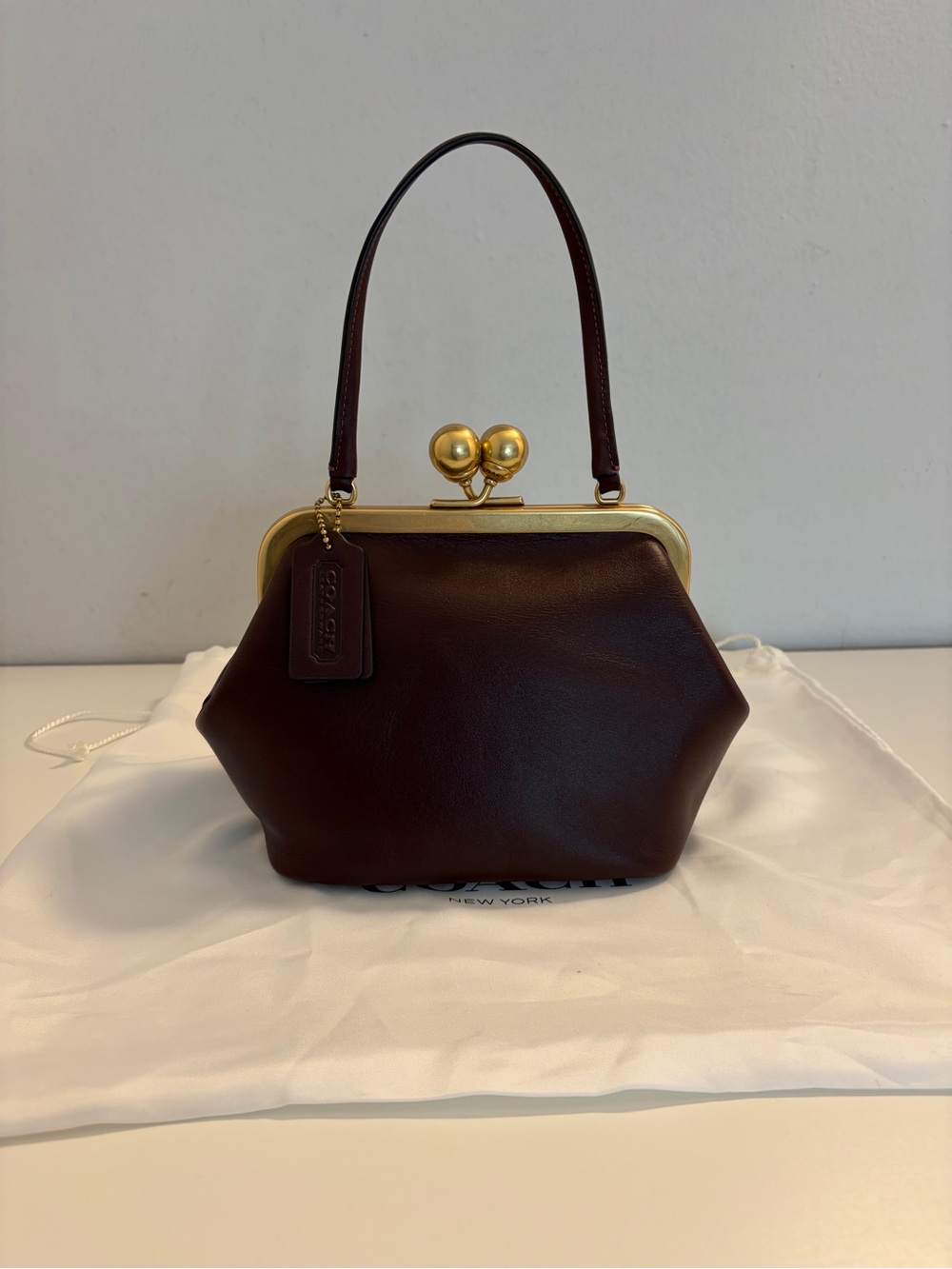 Coach Kisslock 16 in Black Currant.